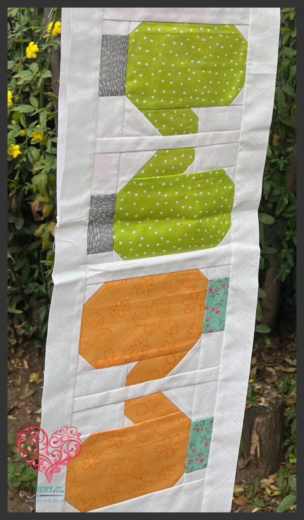 Row Mitones del Quilty Fun usando naranjo,