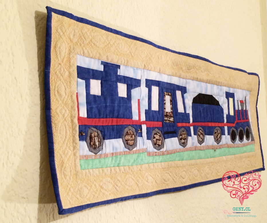Quilt con un tren realizado mediante Foundation Paper Piecing, uno de mis primeros proyectos de patchwork terminado en 2015.