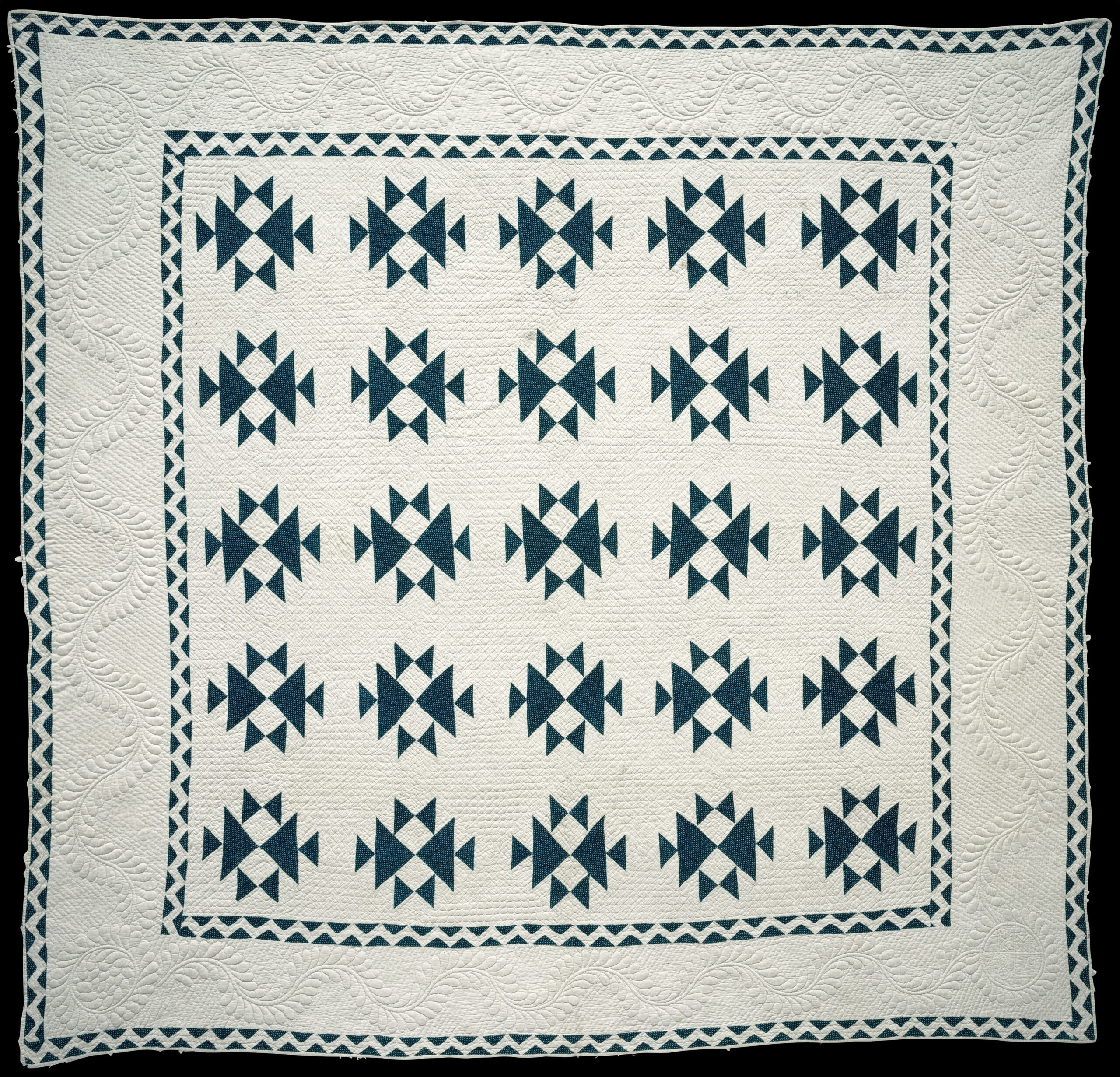 Detalle del Double X Quilt de 1849 con acolchado a mano de Feather Vines y Feather Wreaths.