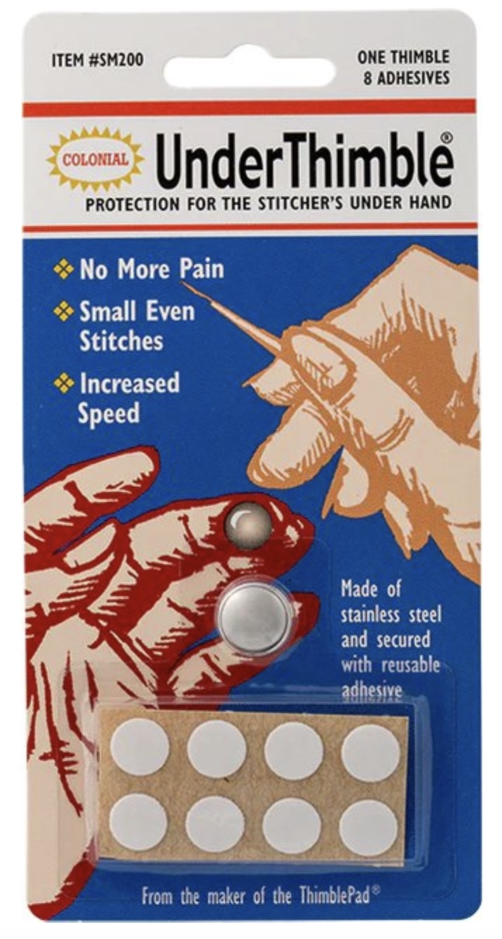 materiales para hand quilting: UnderThimble de Colonial Needle, protector adhesivo para el dedo inferior, uno de los accesorios para Hand Quilting y acolchado a mano.